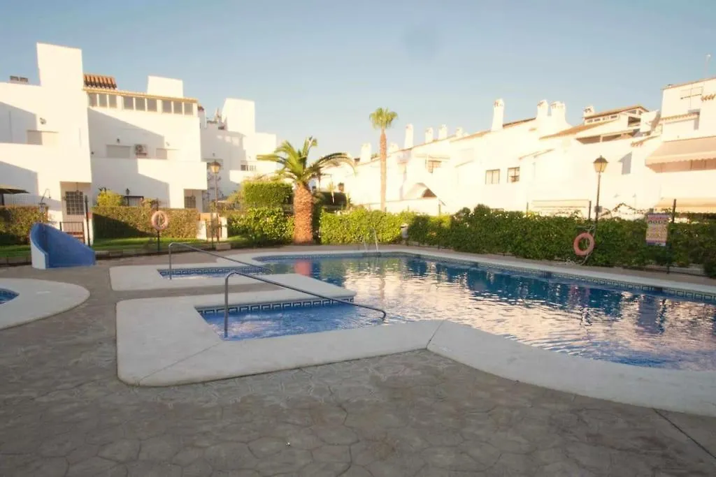 Holiday home Adosado En Playa Vera,3 Piscinas Spain